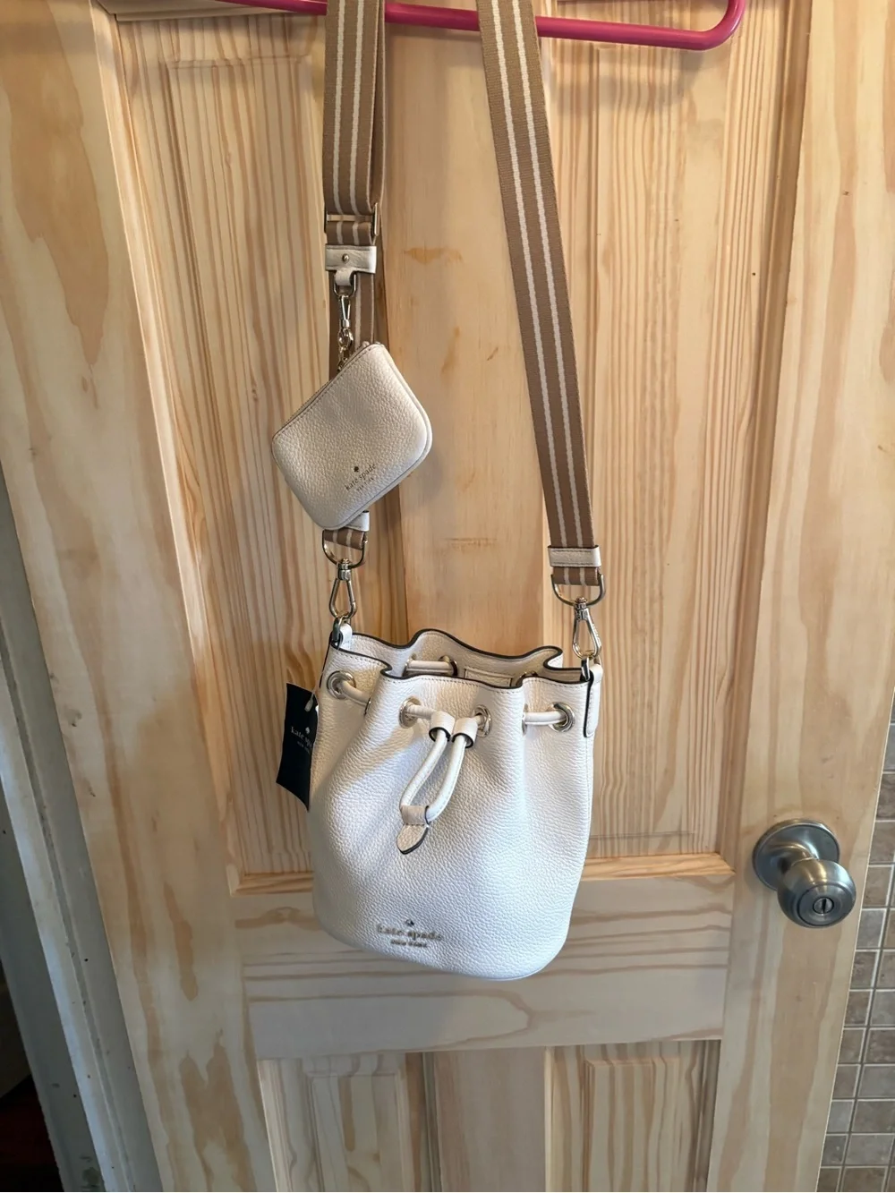 kate spade Cream Pebbled Leather Drawstring Crossbody with Striped Strap